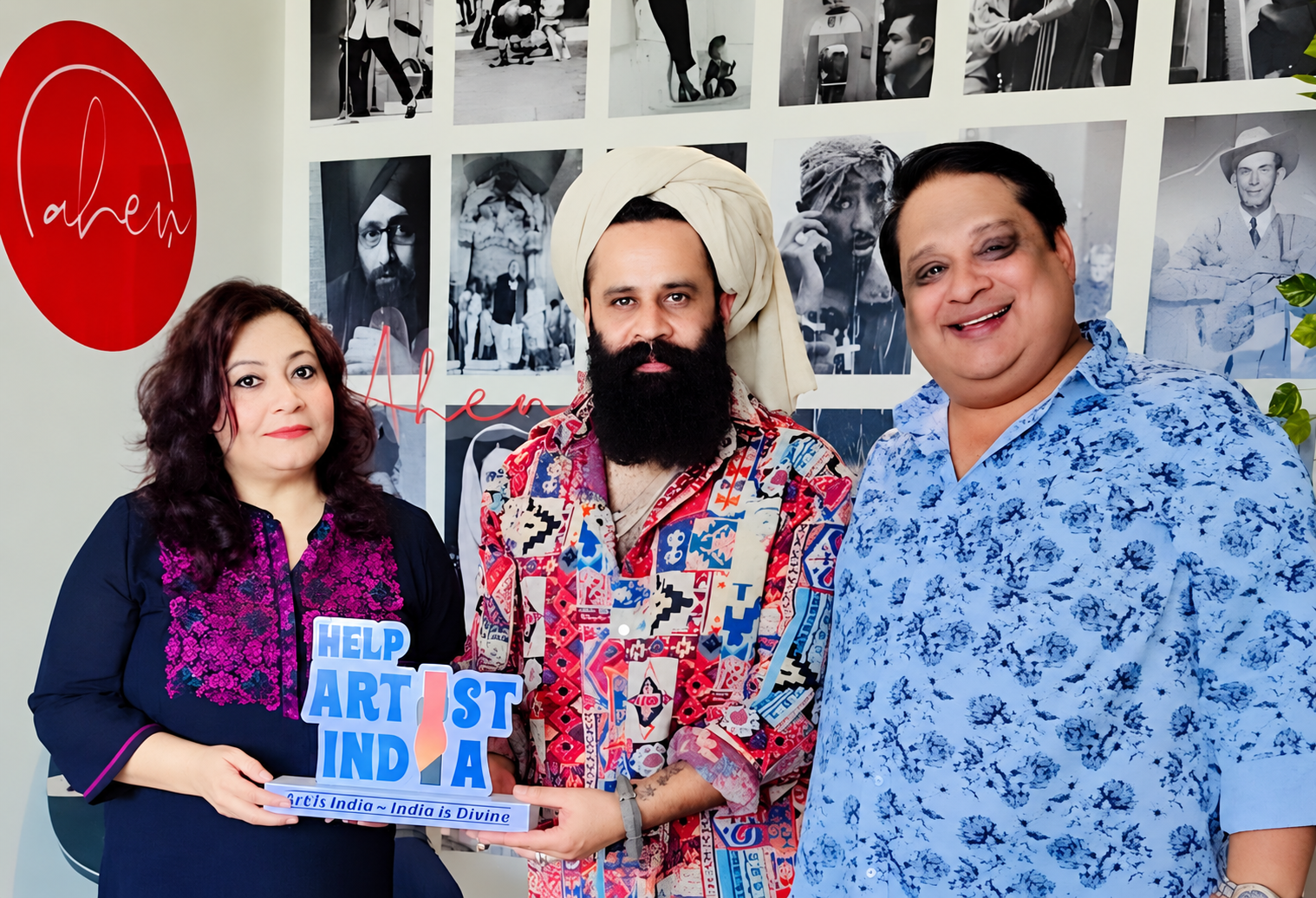 Artists and foundation members posing with a Help Artist India sign